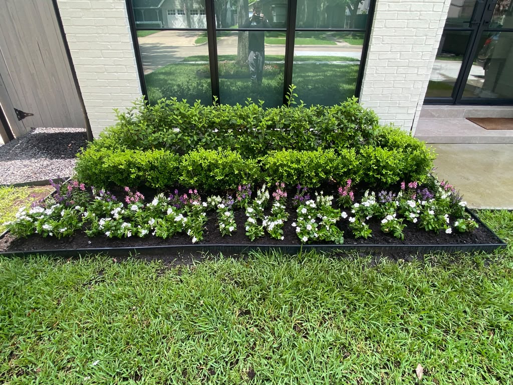 Residential flower planting project by Rainlandscaping
